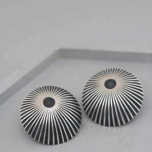 Black and silver stud earrings handmade by Louy Magroos