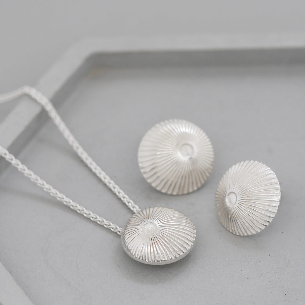 silver stud earrings with matching necklace