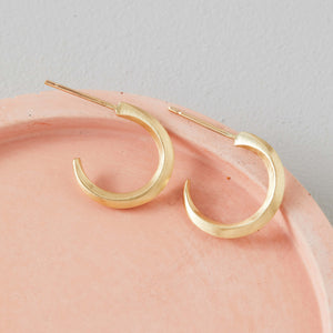 Real gold small hoop earrings photographed on pale pink dish, 9ct hoop earrings elegant gift