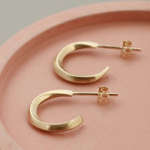 Real gold small hoop earrings on a pale pink dish, 9ct hoop earrings birthday gift idea