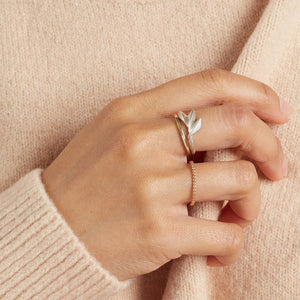 Sterling silver statement ring worn on a woman's hand, featuring a bold Art Deco-inspired geometric fan shape