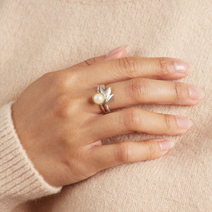 Art Deco style ring in solid sterling silver modelled on a woman's hand, showing the fan-shaped design and polished finish