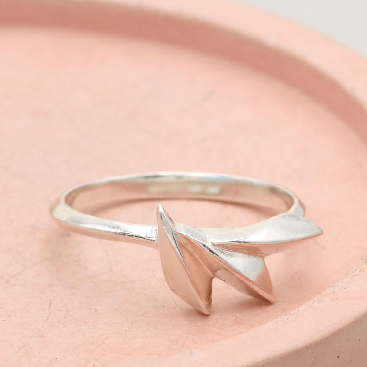 Silver statement ring with an Art Deco-inspired fan shape, showing the detailed ridges and polished sterling silver finish