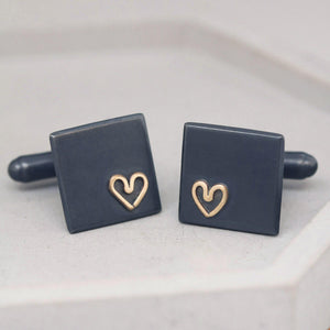Close-up of sterling silver Groom wedding cufflinks with gold heart detail, thoughtful anniversary gift for husband.