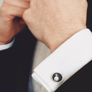 Oxidised sterling silver pearl cufflinks worn on a crisp white shirt, ideal as a pearl anniversary gift for him.