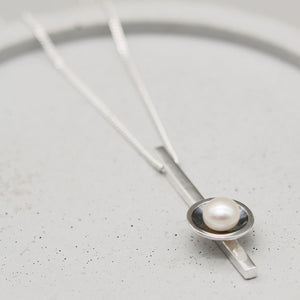 Black pearl bar necklace featuring a freshwater pearl in an oxidised sterling silver Art Deco inspired pendant.