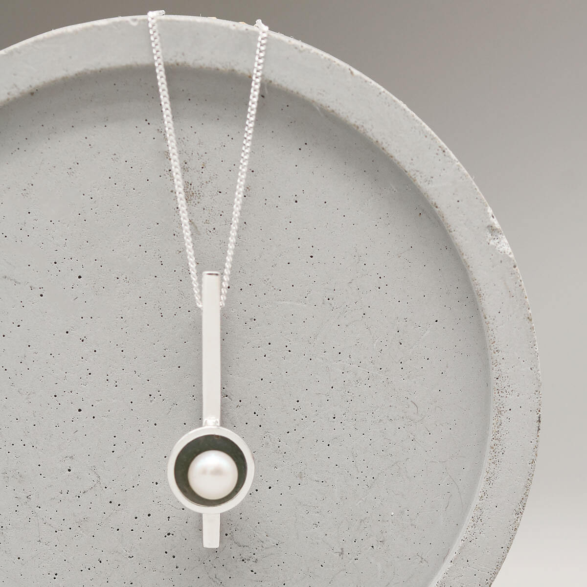 Handmade black pearl bar necklace in oxidised sterling silver with a genuine freshwater pearl on a fine silver chain.