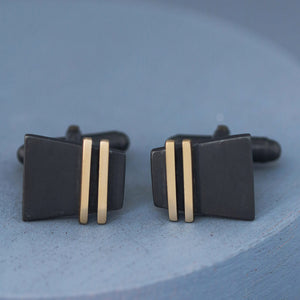 Detailed image of Black and Gold cufflinks on deep blue background showing oxidised silver texture, perfect special cufflinks for elegant gifting occasions.