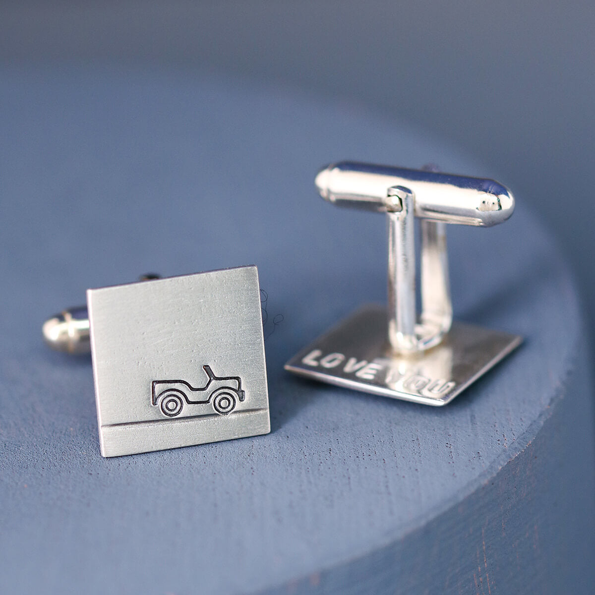 One Car cufflink face on and one upturned to show secret message on the reverse, unique gift for car lovers and thoughtful wedding gift.