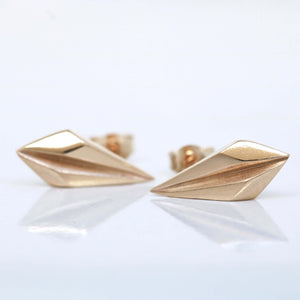 Gold art deco earrings front view on pale grey, unique geometric jewellery gift for wife or girlfriend.
