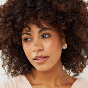 Large freshwater pearl earrings worn by model showing scale and fit