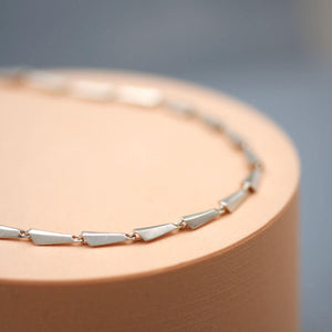 Art Deco necklace in solid sterling silver showing the detailed shape and movement of each individual link