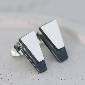 Close-up of sterling silver black earrings on grey dish highlighting oxidised detailing, ideal graduation or thank-you gift.