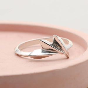 Art Deco fan ring in solid sterling silver displayed on a pink dish, a distinctive silver statement ring with geometric design