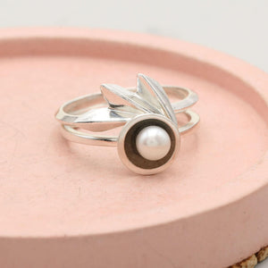 Geometric sterling silver fan ring with faceted ridges that catch the light, distinctive statement ring for women