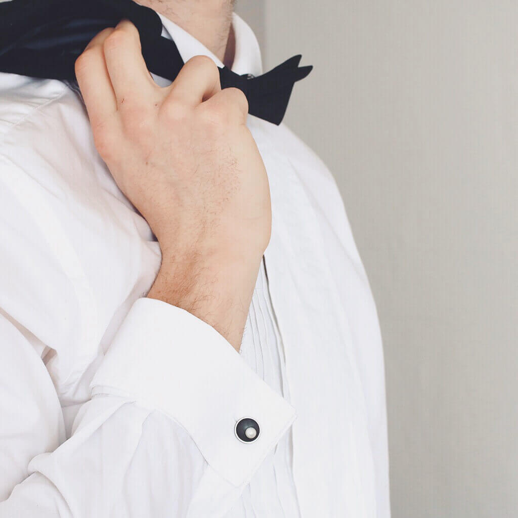 Handmade sterling silver pearl cufflinks shown worn with a white shirt, highlighting their elegant Art Deco design.