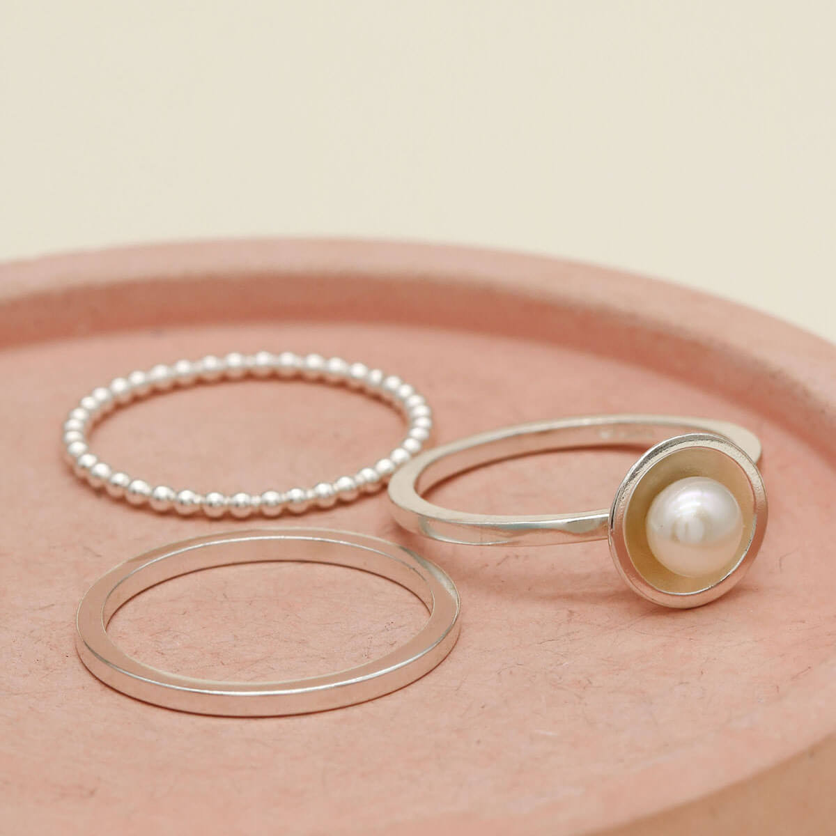 Sterling silver stacking ring set including pearl ring, beaded ring and plain band