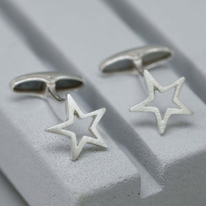 Refined silver Star cufflinks shown up close on a grey dish – a thoughtful graduation gift for son or accessory for special events.