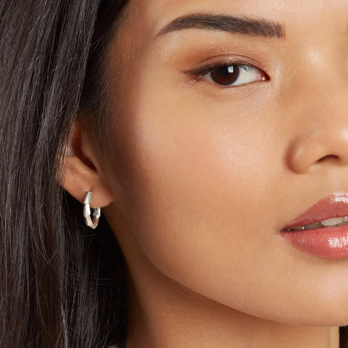 Sterling silver hoop earrings worn as an everyday jewellery look, a distinctive handmade gift for her