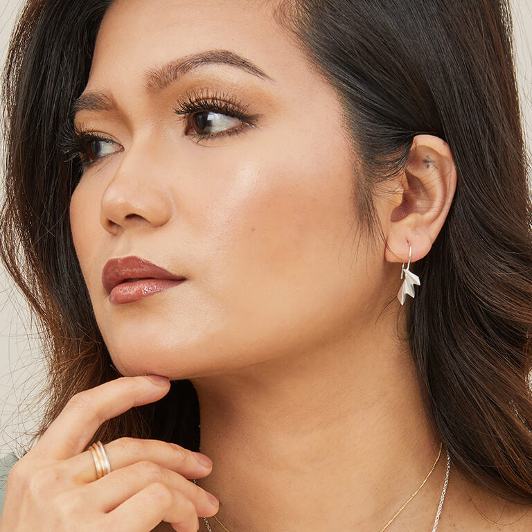 Model wearing art deco drop earrings showing the elegant fan shape; perfect fan drop earrings for special occasions or gifting.