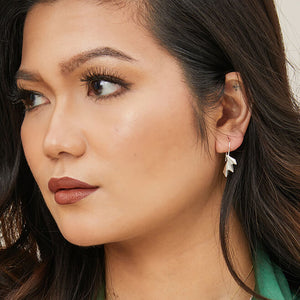 Fan drop earrings worn by model, highlighting how the ridged art deco design catches the light; ideal wedding or bridesmaid gift.