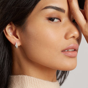 Close-up of model wearing art deco stud earrings, demonstrating their subtle yet striking design perfect for birthdays, anniversaries, or wedding jewellery.