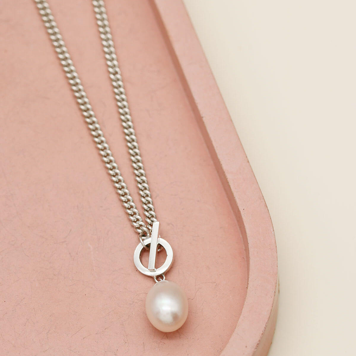 Contemporary sterling silver toggle pearl necklace featuring one of the largest freshwater pearls in the Louy Magroos collection.