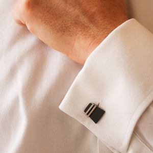 Handcrafted black cufflinks worn on a white shirt, showing their bold contrast and sleek modern design. A sophisticated gift for husband or anniversary present.