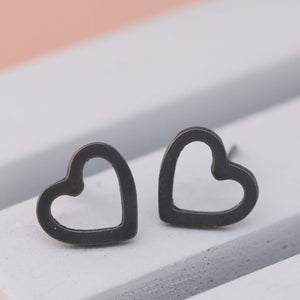 Oxidised black heart sterling silver earrings on grey dish, modern heart shaped silver earrings