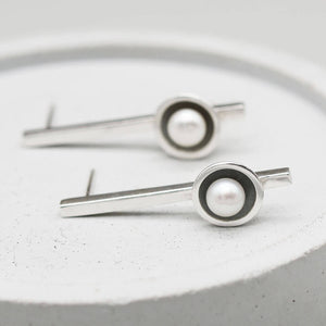 Oxidised sterling silver long pearl earrings inspired by Art Deco design with handcrafted freshwater pearl settings.