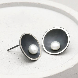 Close-up of Signature Black Pearl Stud Earrings featuring handcrafted oxidised sterling silver and genuine freshwater pearls.