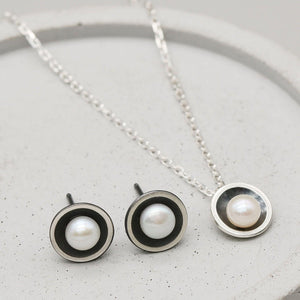 Handmade oxidised sterling silver pearl pendant necklace paired with coordinating black pearl stud earrings.