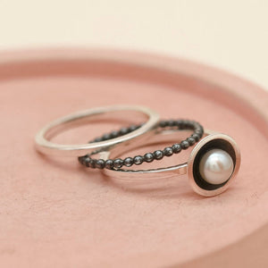 Handmade black pearl ring stack designed for layering and everyday wear