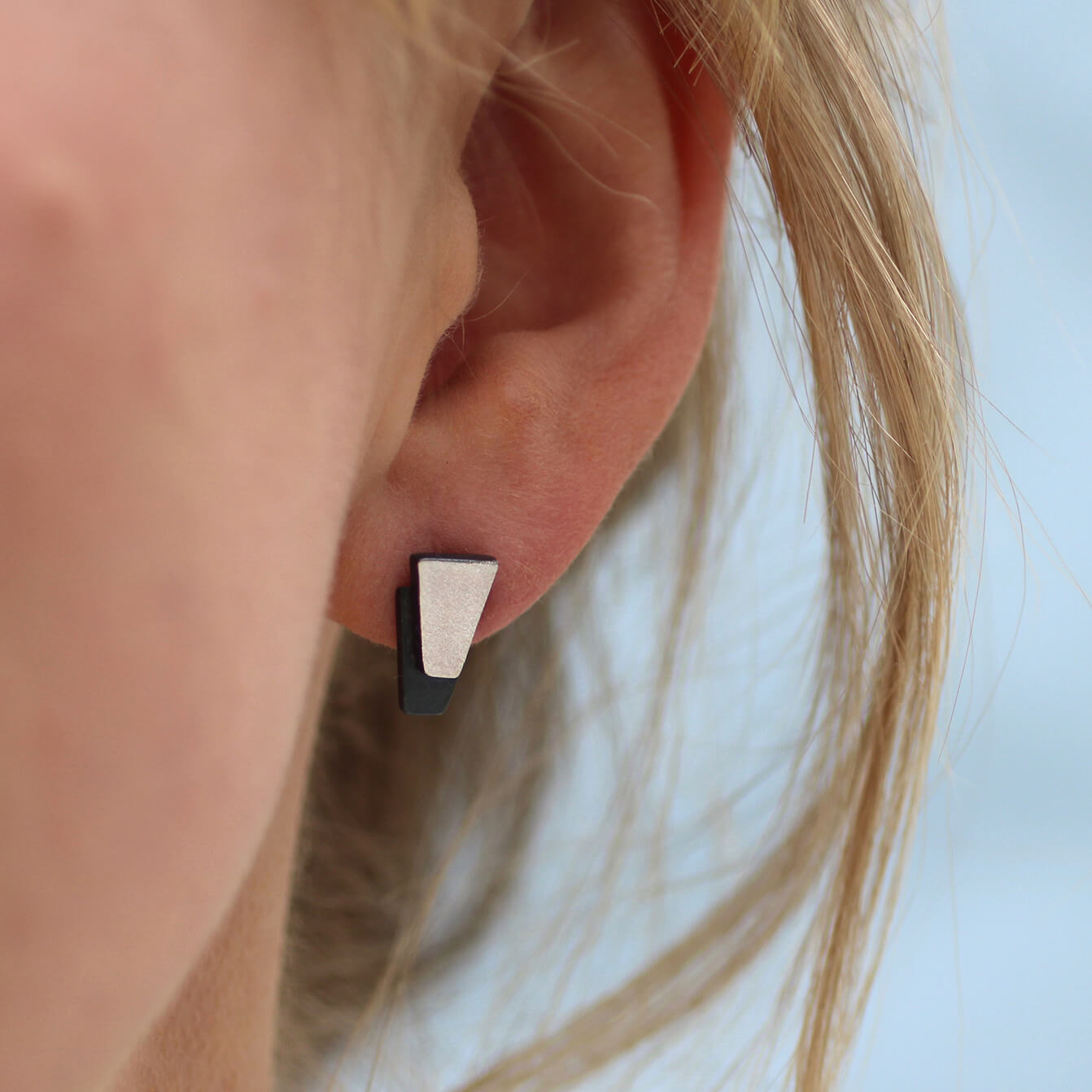 Model wearing black stud earrings for women, sterling silver black earrings styled for everyday outfits or thoughtful gifting.