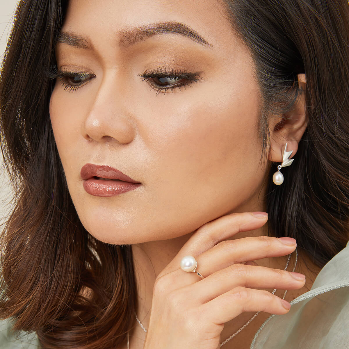 Side profile model shot showcasing the movement of the Art Deco pearl earrings, timeless sterling silver gift for her.