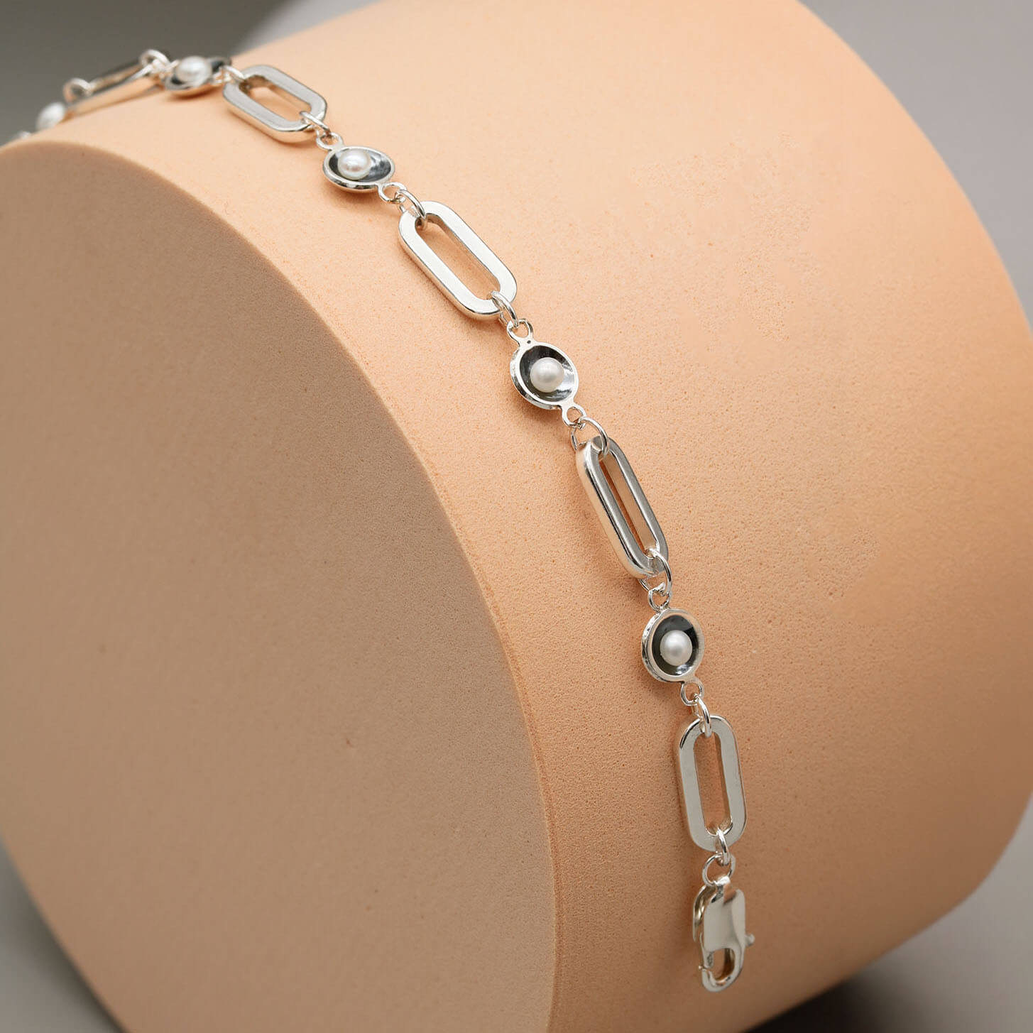 Black pearl bracelet with rectangular sterling silver trace chain and five genuine freshwater pearls in signature oxidised settings.