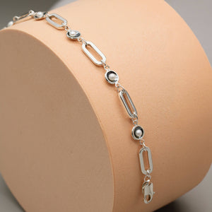 Black pearl bracelet with rectangular sterling silver trace chain and five genuine freshwater pearls in signature oxidised settings.