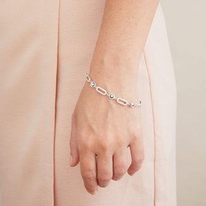 Black pearl chain bracelet worn as a statement bracelet, featuring bold sterling silver links and genuine freshwater pearls.