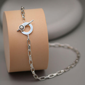 Chunky pearl statement necklace crafted from solid sterling silver, showcasing the contemporary T-bar fastening and large freshwater pearl.