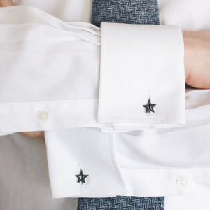 Matte black Star cufflinks being worn on a cuff – bold and stylish, an ideal graduation gift for son or modern formalwear upgrade.