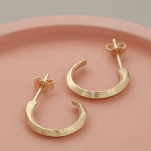 9ct hoop earrings styled on pale pink dish, real gold small hoop earrings minimalist style