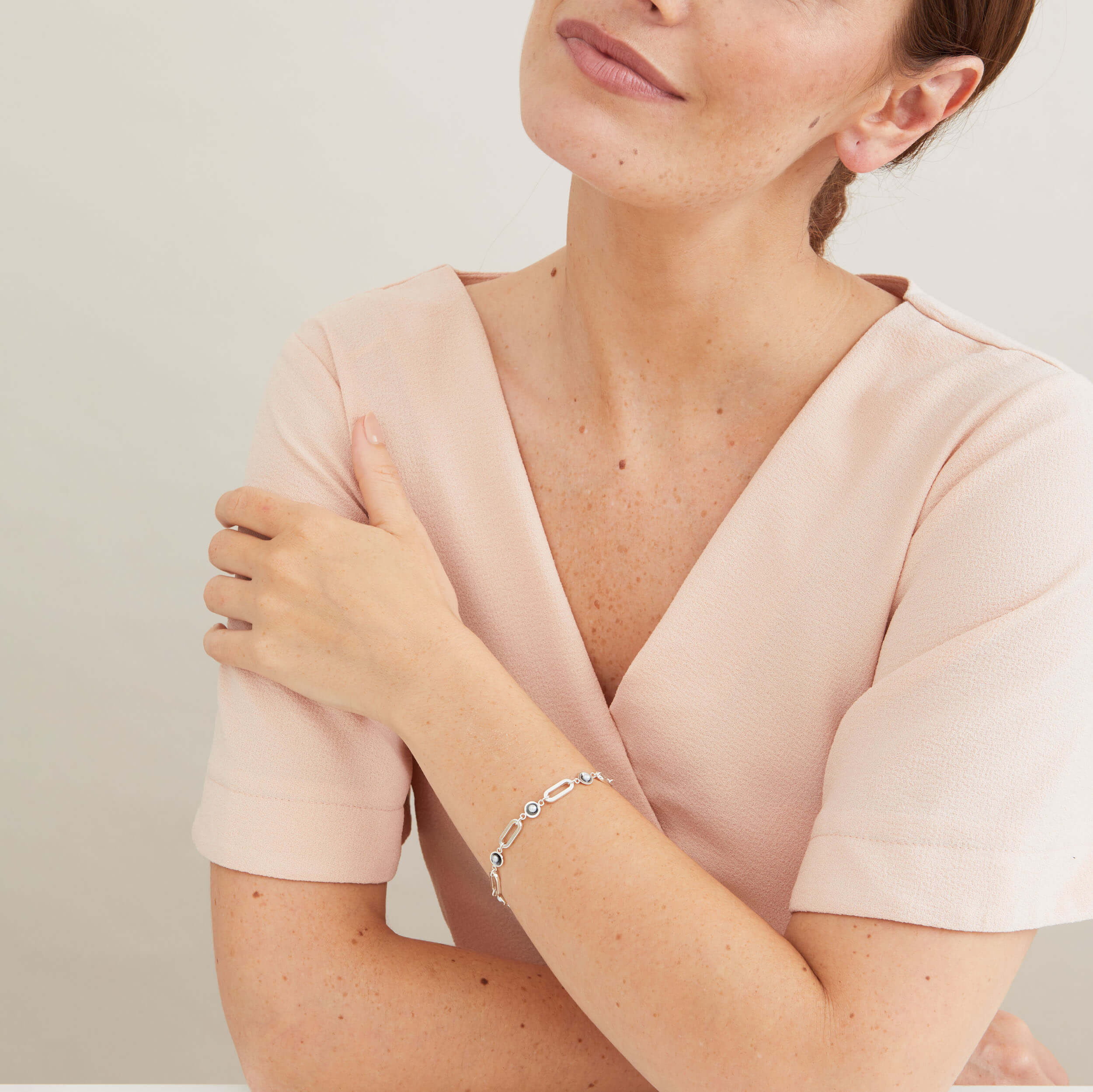 Handmade black pearl bracelet styled with everyday clothing, highlighting the contemporary Art Deco-inspired design.