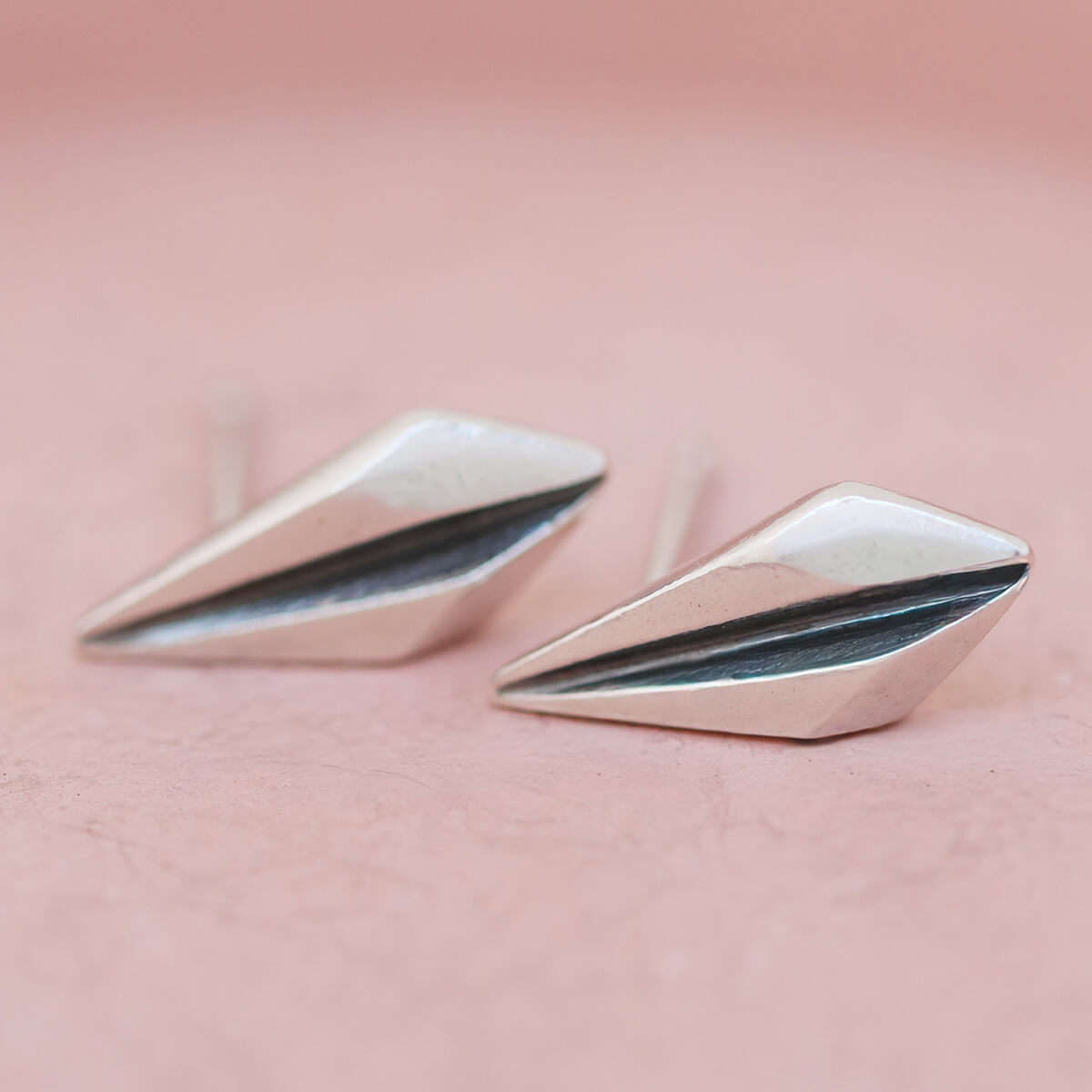 Silver art deco earrings on pink dish styled as a gift for her or bridesmaid jewellery.