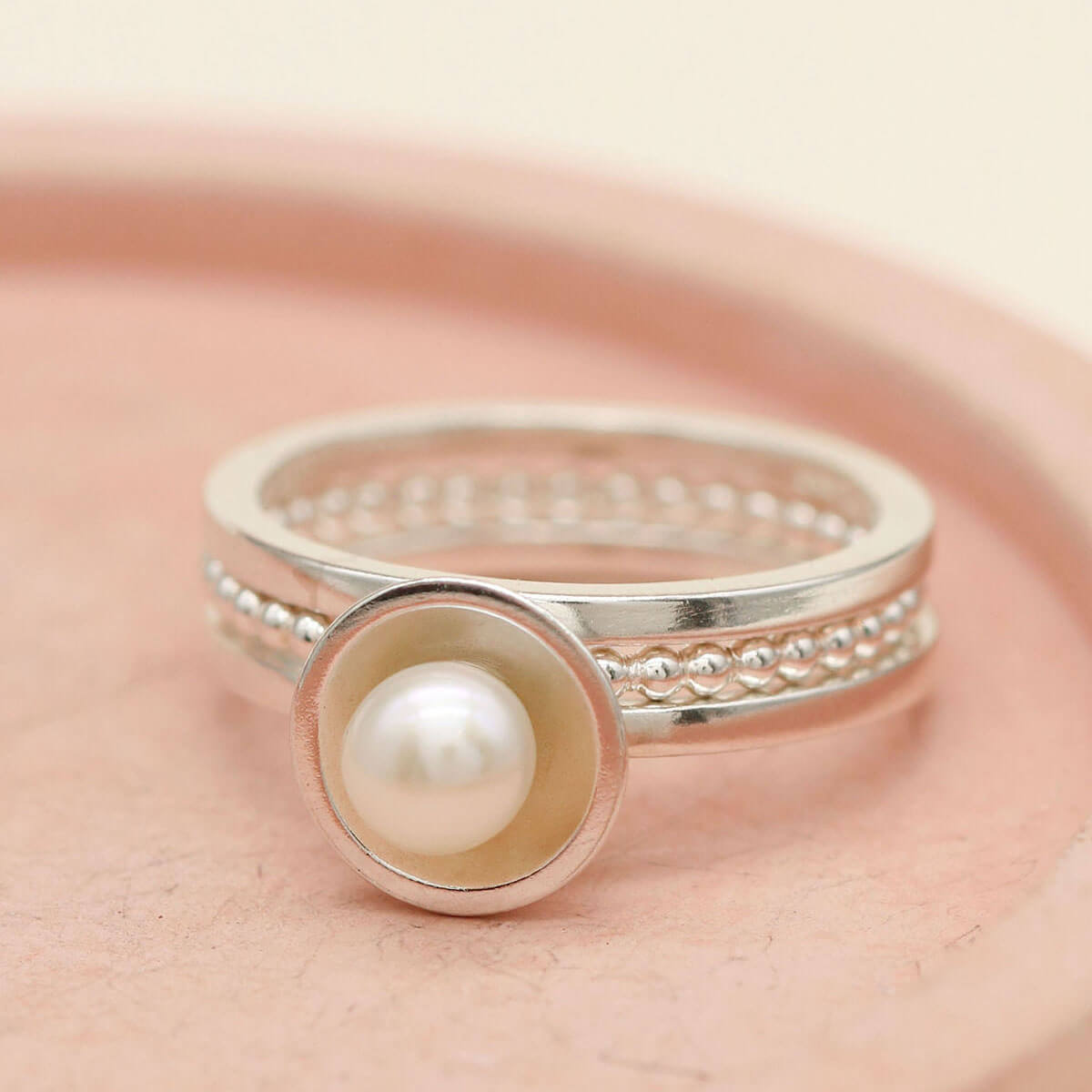 Freshwater pearl ring set with three sterling silver rings designed for stacking
