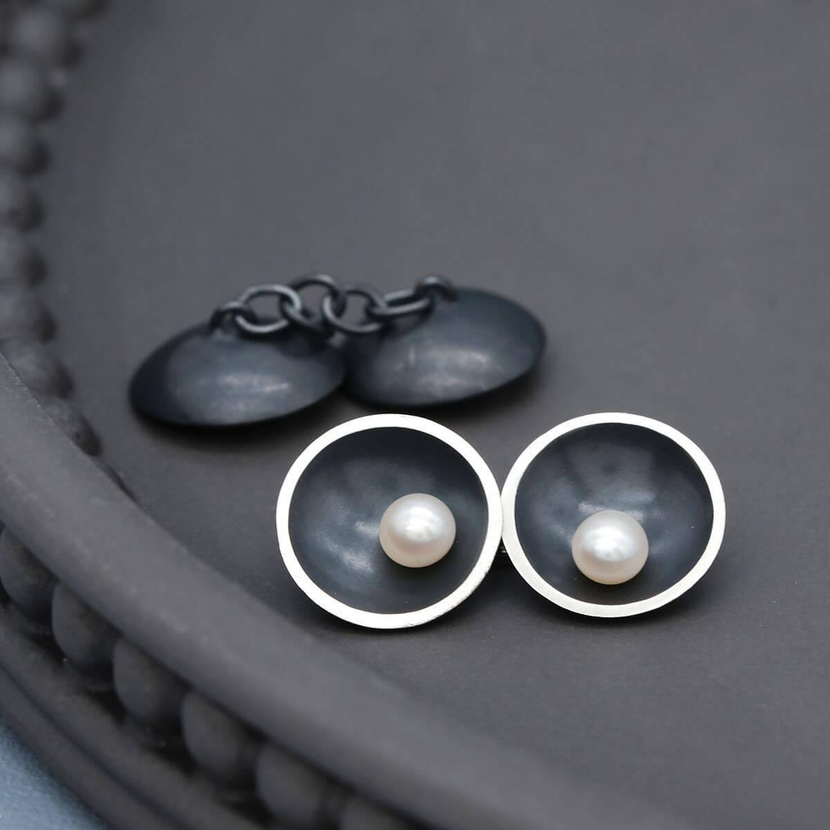 Black double-sided pearl cufflinks showcasing genuine freshwater pearls and elegant Art Deco styling.
