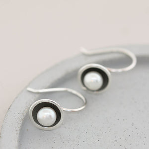 Black freshwater pearl drop earrings handcrafted in sterling silver with elegant fixed hook ear wires.