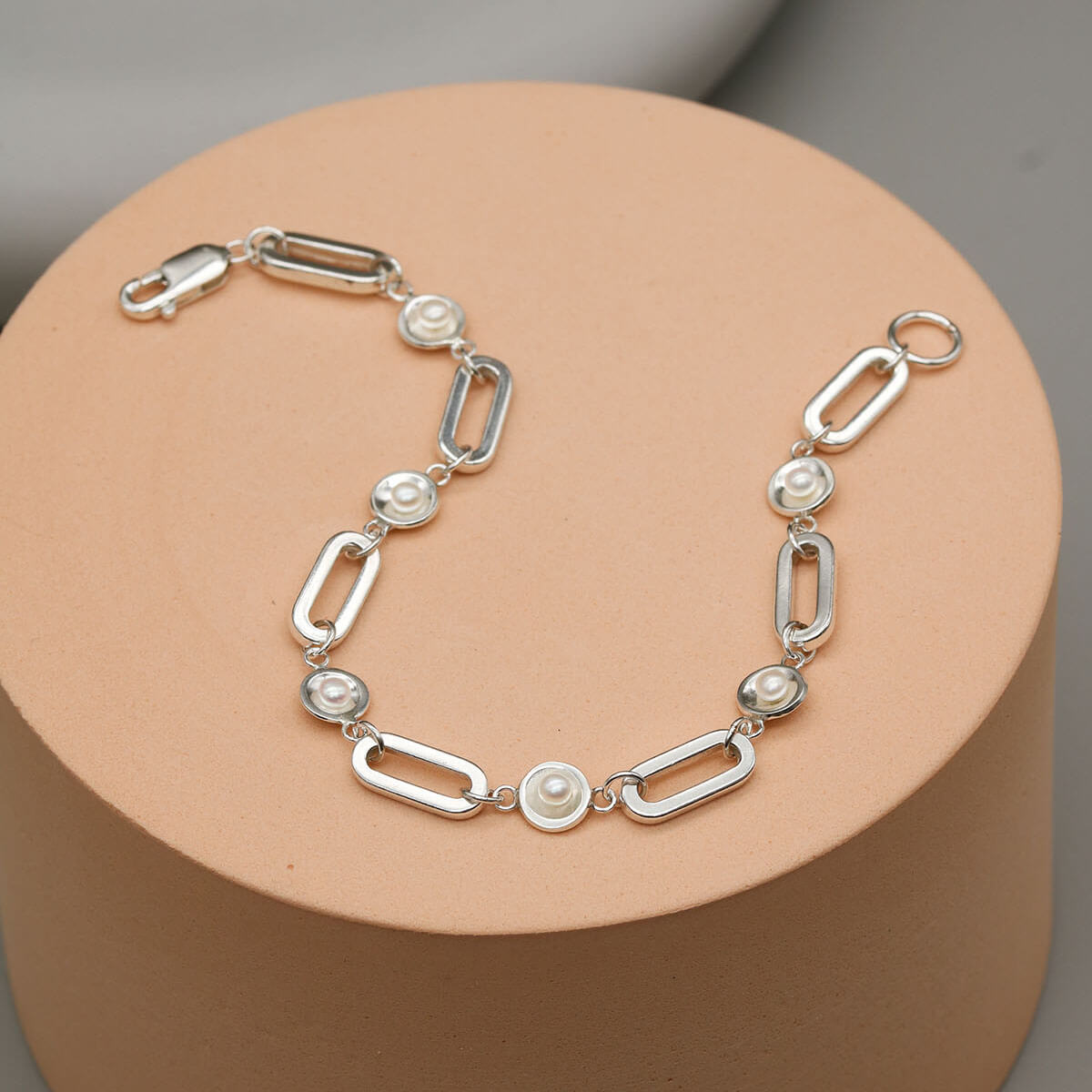 Sterling silver pearl chain bracelet handcrafted in the UK with bold rectangular sterling silver links and genuine freshwater pearls.
