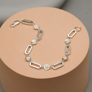 Sterling silver pearl chain bracelet handcrafted in the UK with bold rectangular sterling silver links and genuine freshwater pearls.
