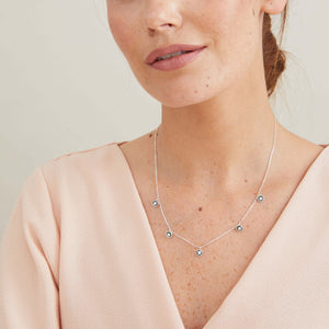 Handmade black pearl chain necklace styled on a model, highlighting the adjustable length and elegant everyday design.