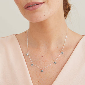 Delicate mini pearl necklace in oxidised sterling silver worn layered at the neckline for a contemporary look.